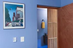 a hallway with a picture of a city on the wall at Departamento Colima in La Paz