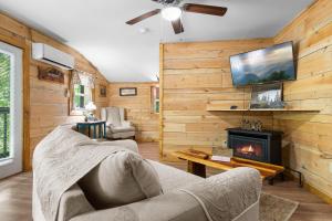 a living room with a couch and a fireplace at Bears Tree 2 in Sevierville