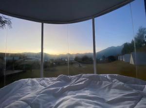 Postel nebo postele na pokoji v ubytování Kasmi Mount Batur