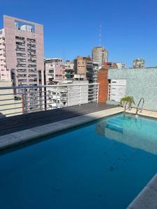 a swimming pool on the roof of a building at Calma Home in Buenos Aires