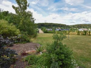 a view of a garden with a field and trees at Cottage in Germany with Sun Terrace & BBQ in Berlingen