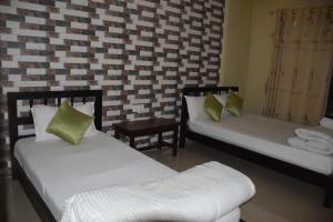 Postel nebo postele na pokoji v ubytování Hotel Garangja