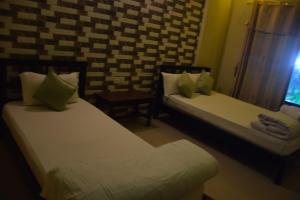 Postel nebo postele na pokoji v ubytování Hotel Garangja