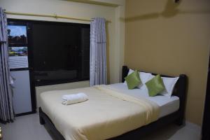 Postel nebo postele na pokoji v ubytování Hotel Garangja