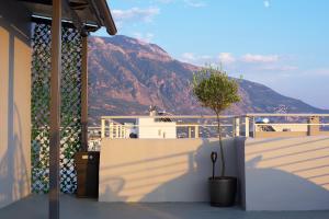 a balcony with a view of a mountain at Kiriakos Apartment in Kalamata
