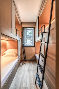 a dorm room with bunk beds and a bed at Zunjing Boutique Hotel Nanjing Confucius Temple in Nanjing