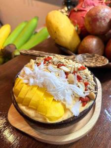 a bowl of food on a table with fruits and vegetables at Sleep tight hostel koh tao in Koh Tao