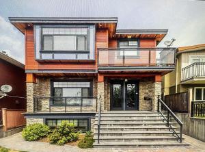 a house with a staircase in front of it at Jennifer's House in Vancouver