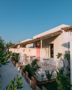 a house with a porch and a balcony at The Luxe Pushkar By Namli Hotels in Pushkar