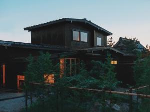 a house in the middle of a forest at こもる五所川原 in Goshogawara