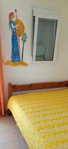 Кровать или кровати в номере Sifis Pirounakis Anatoli