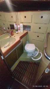 a small bathroom with a toilet and a sink at Best Barcelona boat experience in Barcelona