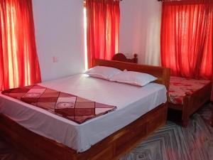 Ένα ή περισσότερα κρεβάτια σε δωμάτιο στο Moon moon Garden