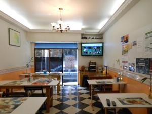 TV a/nebo společenská místnost v ubytování Hostel Vergueiro