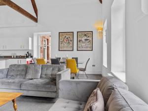 a living room with a couch and a table at Pass the Keys Yew Tree Stunning Apartment with Sea View in Grange Over Sands