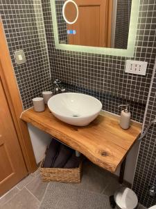 a bathroom with a sink and a mirror at Appartamento Kern-Sciare A Portata Di Mano- in Madesimo +37 photos