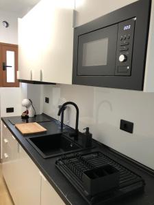 Kuchyň nebo kuchyňský kout v ubytování Tu apartamento en vacaciones