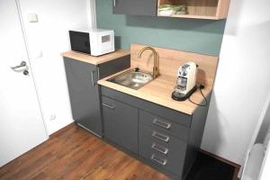 Kuchyň nebo kuchyňský kout v ubytování Mini Apartment in Amstetten