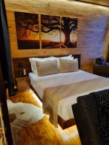 a bedroom with two beds in a room at Parador dos Canyons in Cambará