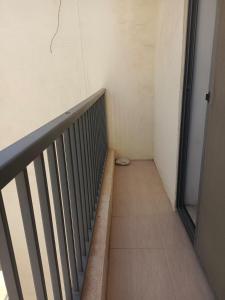 a staircase in a room with a door and a floor at you can enjoy your time at waterford apartment in Attard