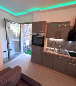 a kitchen with green lights on the ceiling at Mini Suite 35 qm in Calera