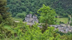 an aerial view of a house on a mountain at Tuca - Triplex Priviletge con encanto in Vielha