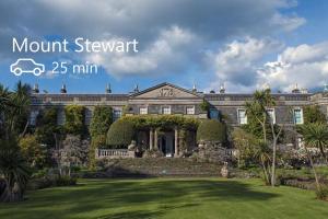 an image of a mansion with the words mount stewart min at Nara Seaside Retreat in Holywood