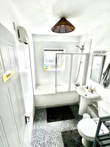 a bathroom with a toilet and a sink at CustomHouse Balcony view, Dublin 1 in Dublin