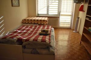 En eller flere senge i et værelse på PAVIN Apartment