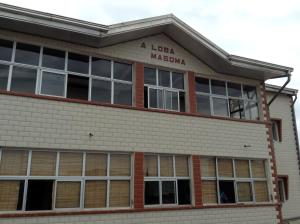a larger macaya building with a sign on it at Bolo Residence Douala in Douala
