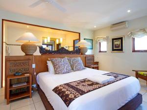 Postel nebo postele na pokoji v ubytování Noosa Dua 2 Balinese Retreat