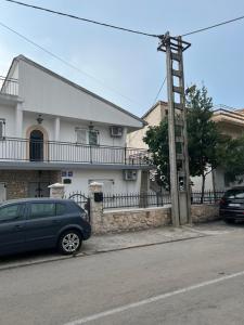 a blue car parked in front of a house at Leyla in Vodice