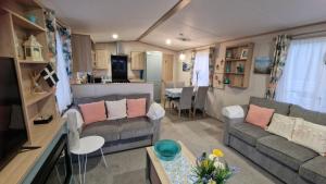 a living room and kitchen in a tiny house at Roecliff in St Austell