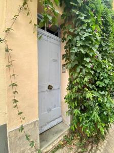 a white door in a building with a plant at Click! Casa Lamartine Fabulous Ideal Location Walk to ALL!!! in Cassis