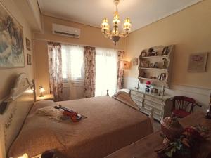 a bedroom with a bed and a dresser and a window at Something About Mary in Athens +15 photos