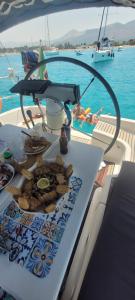 a table on a boat with a plate of food at ONLY YOU al trapezoidale Palermo in Palermo