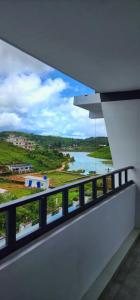 a view of a river from a building balcony at Rock Lake Villa in Vagamon