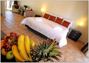 a bed with a bunch of bananas on top of it at Mungo Lodge in Mungo