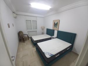 Ένα ή περισσότερα κρεβάτια σε δωμάτιο στο Cozy Inn Lac 2 +1 φωτογραφίες