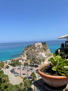 a view of the ocean and a resort at Tenuta La Torre in Tropea