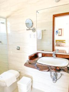 Ett badrum på La Plage Residence
