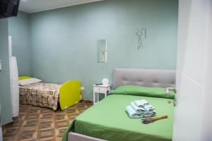 Postel nebo postele na pokoji v ubytování Palazzo DE MATTEO