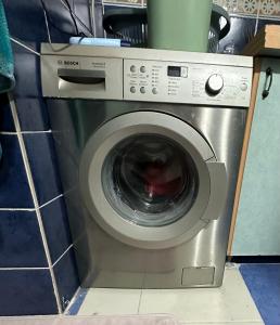 a washing machine sitting in a kitchen with at AC Rooms-Sea 100 meter in Antalya