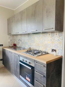 Kuchyň nebo kuchyňský kout v ubytování Casa vacanze MELFA + 5 fotografií