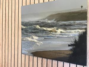 a picture of a beach with the ocean at City Centre Self-contained Studio in Aberdeen