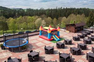 an aerial view of a playground with a slide at Hotel Harmonie in Luhačovice