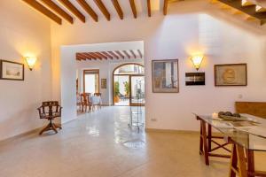 a large living room with a table and chairs at Sa Marilyn - Can Campins in Sa Pobla