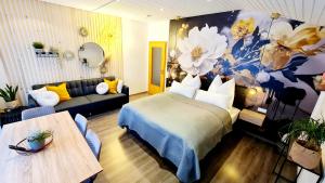 a hotel room with a bed and a couch at Ferienwohnungen Krüger ''Apartment Finn" in Michelstadt