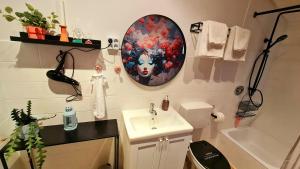 a small bathroom with a sink and a mirror at Ferienwohnungen Krüger ''Apartment Finn" in Michelstadt +13 photos