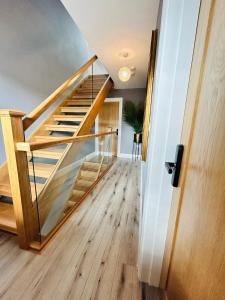 a staircase in a home with wooden flooring and a stair case at Winnie's Lodge in Galway